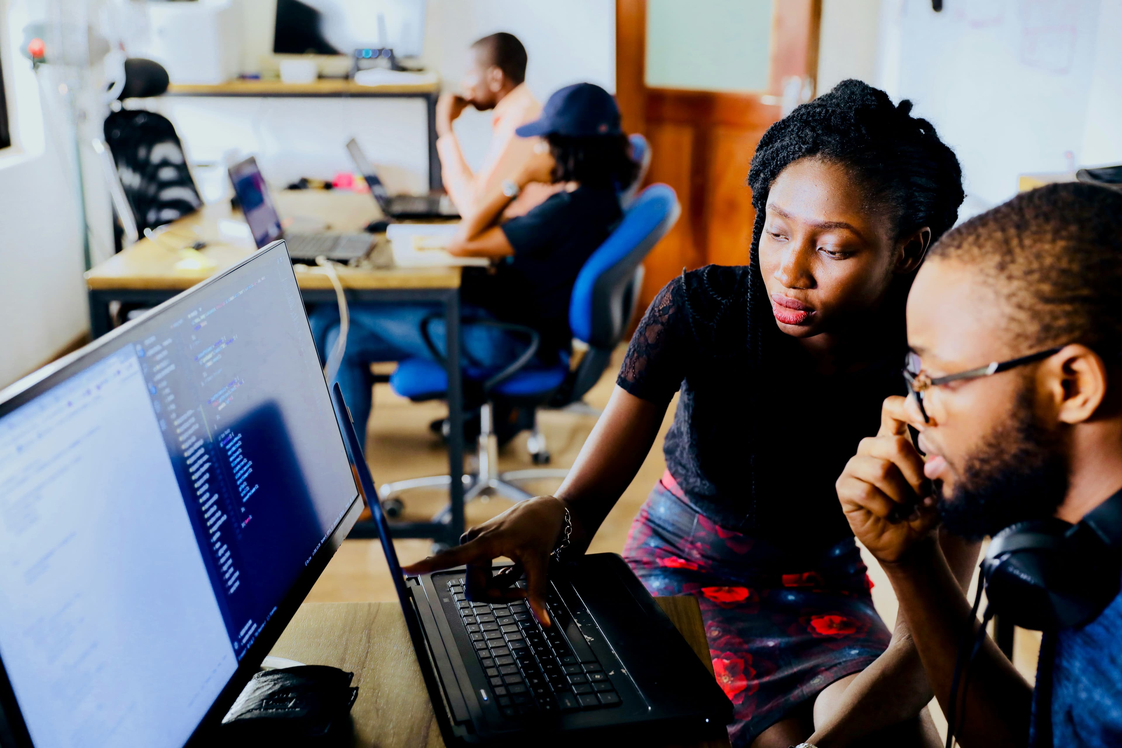 Diverse team collaborating and sharing ideas in a modern office